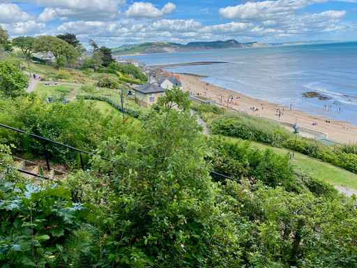Elevated view of a coastal park and sandy beach.